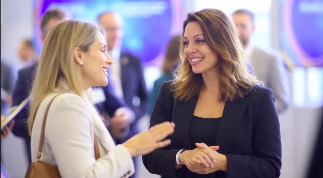 Jessica in conversation at a networking event