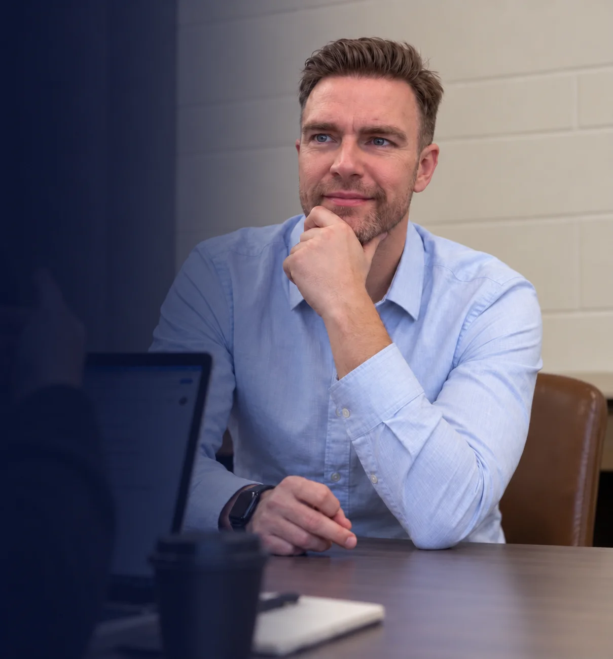 Richard listening closely during a meeting